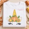 Thanksgiving unicorn applique design embroidered on a folded white shirt