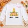 Fall pumpkin unicorn applique embroidered on an open white shirt