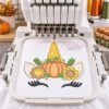 Thanksgiving unicorn applique design displayed in a multi-needle embroidery machine