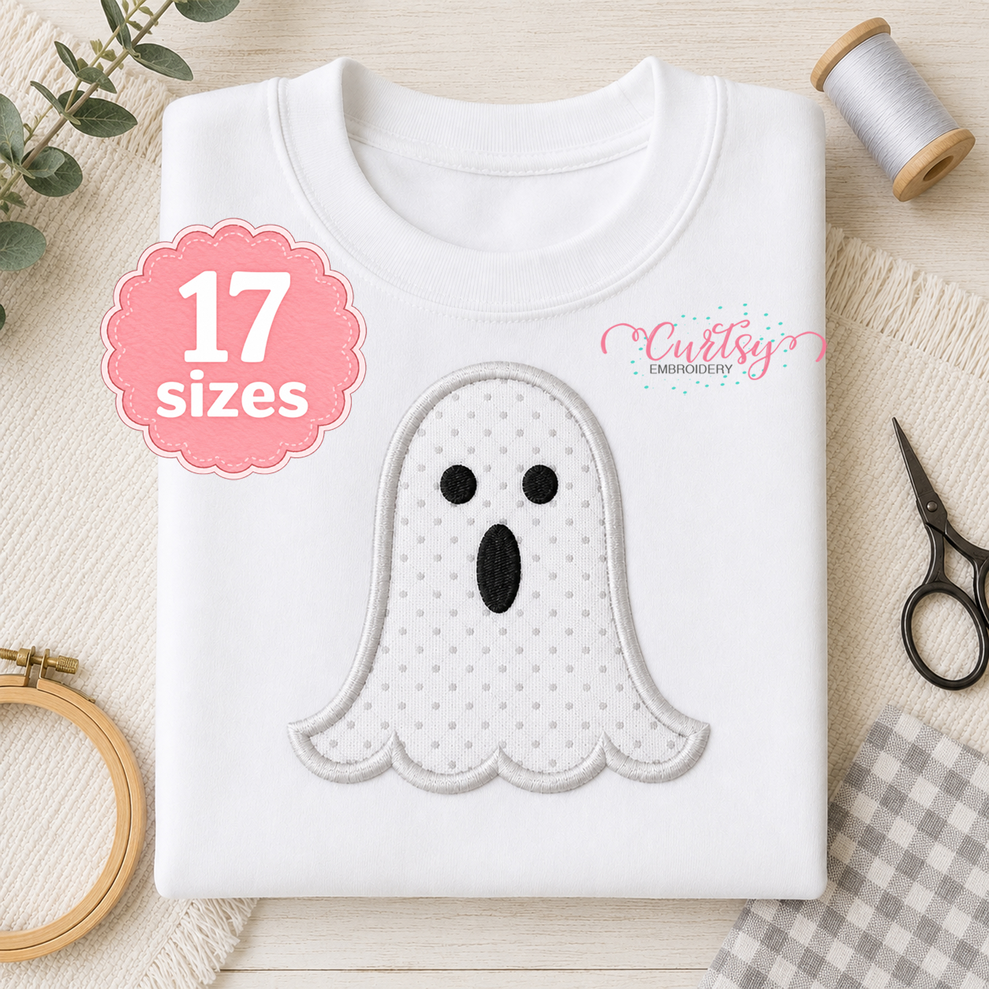 Ghost applique machine embroidery design on a white sweatshirt for Halloween