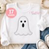 Ghost applique machine embroidery design on a white sweatshirt for Halloween