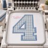 AI-assisted mockup of blue gingham number 4 applique in a plastic hoop mounted in a multi-needle embroidery machine.