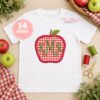 Red gingham apple applique personalized with a green three-letter monogram on an open white shirt