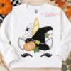 Halloween unicorn applique embroidery design on a white sweatshirt