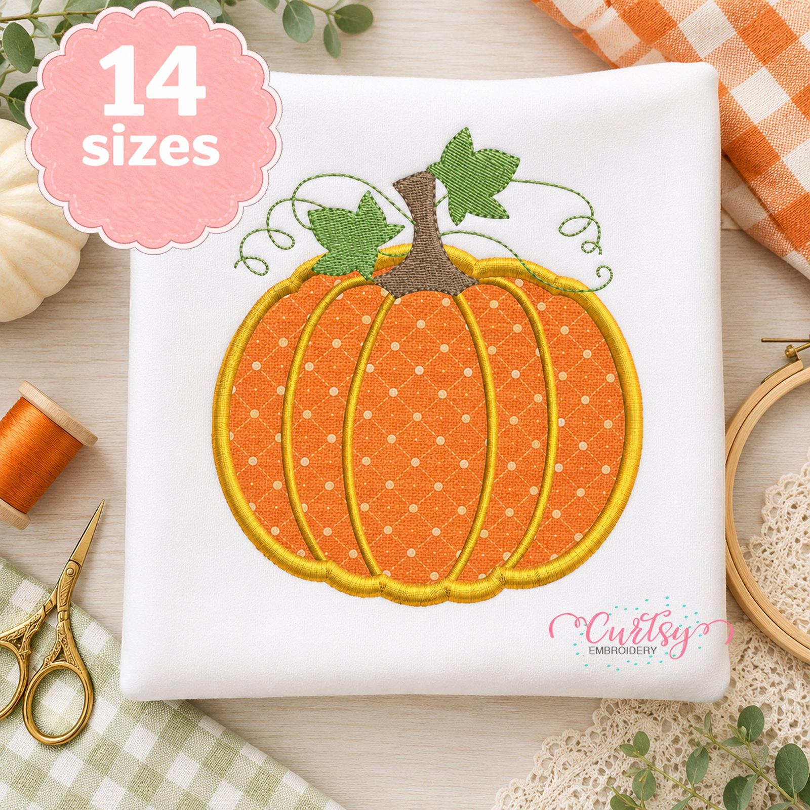 Pumpkin applique machine embroidery design on a white sweatshirt