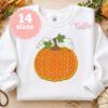 Pumpkin applique machine embroidery design on a white sweatshirt