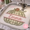 Split pumpkin monogram applique embroidery design being stitched on embroidery machine