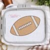 Football sketch fill embroidery design shown in a machine embroidery hoop