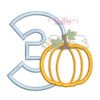 3rd Birthday Pumpkin Applique Embroidery Design with a light blue gingham number three and orange pumpkin on a folded white shirt.