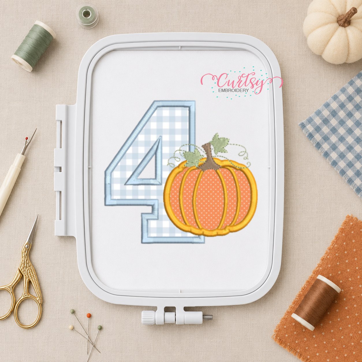 4th Birthday Pumpkin Applique Embroidery Design _ Logo 2 4th Birthday Pumpkin Applique Embroidery Design stitched in a plastic machine embroidery hoop.