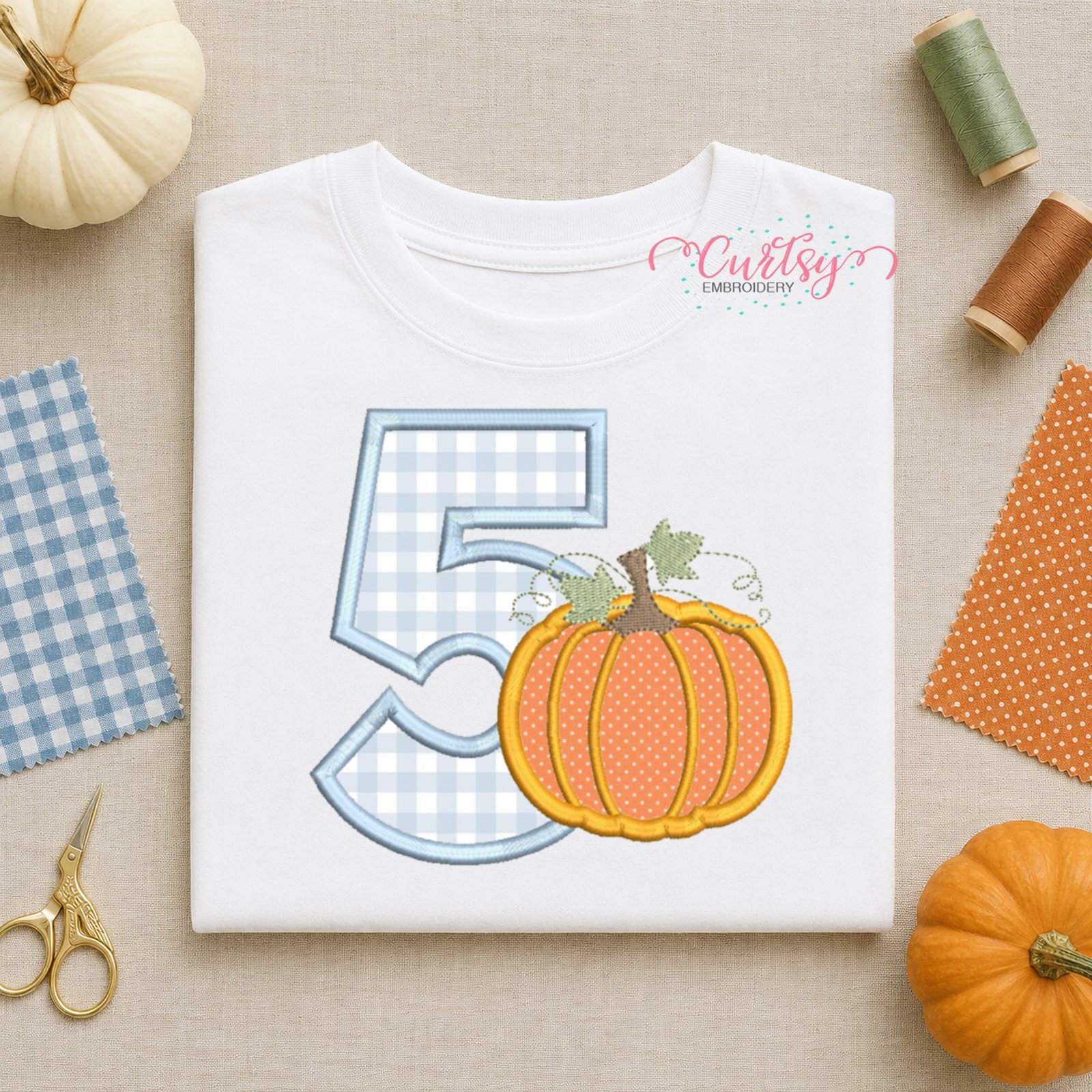 Close-up preview of the number five pumpkin applique machine embroidery design.