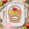 Apple Basket Monogram Applique with Mason stitched on white fabric in a plastic embroidery machine hoop