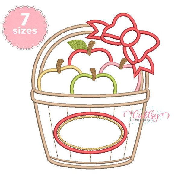 Apple Basket with Bow Applique Design _ Website Apple basket with bow applique embroidery design stitched on a folded white shirt