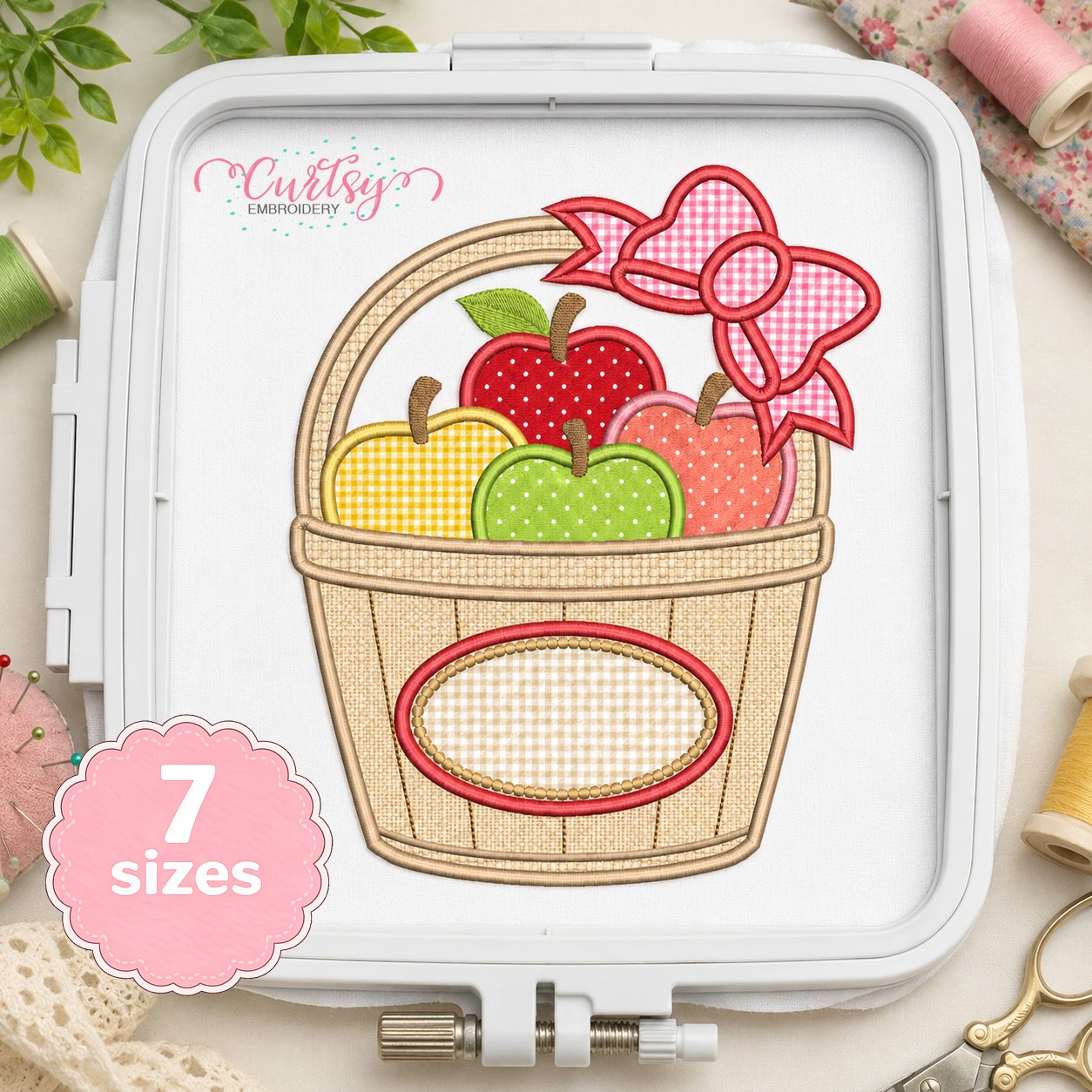 Apple Basket with Bow Applique Embroidery Design _ Logo 2 Apple basket with bow applique embroidery design stitched in a plastic machine embroidery hoop