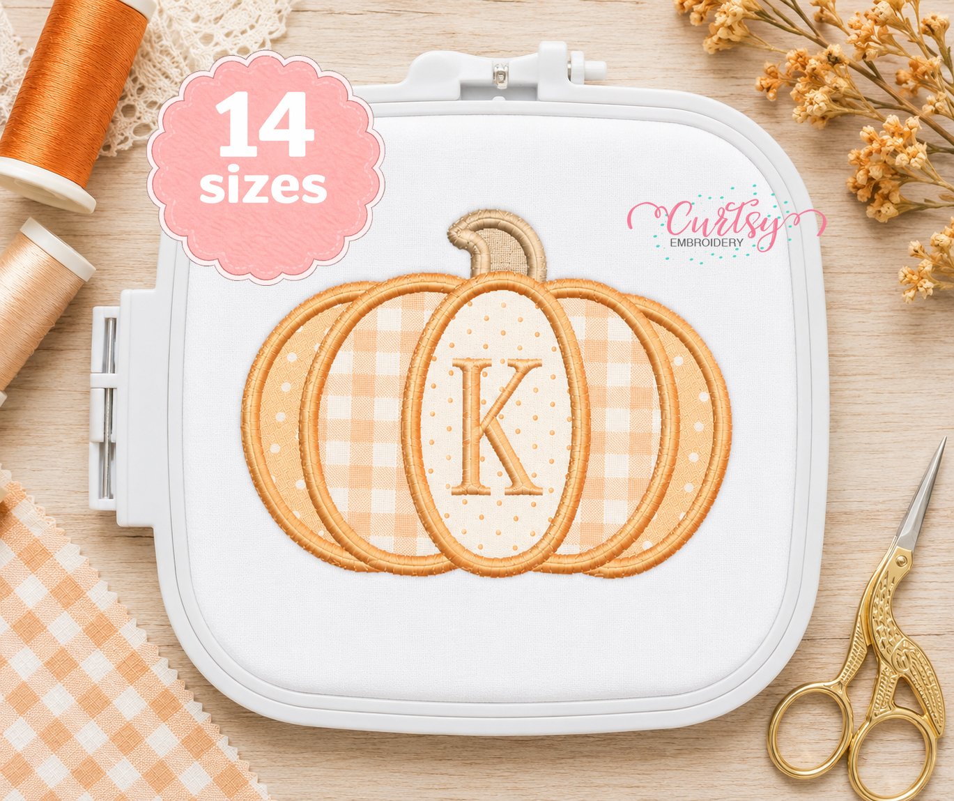 Patchwork pumpkin applique design in embroidery machine hoop
