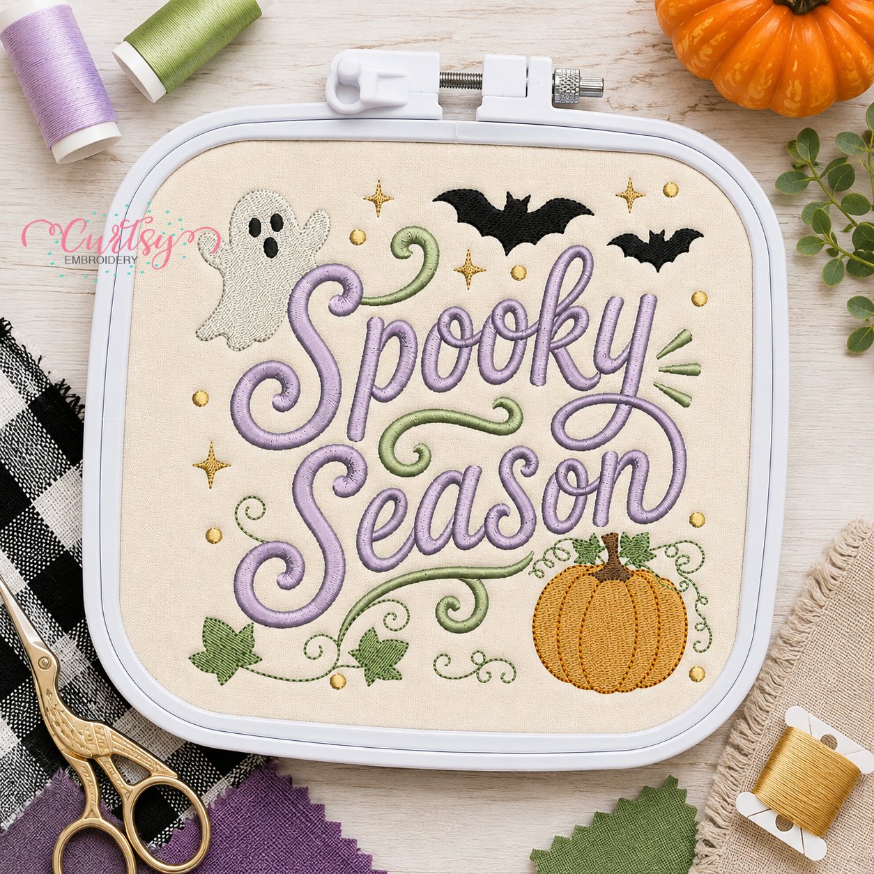 Spooky Season embroidery design shown in machine embroidery hoop