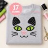 Cat face applique embroidery design stitched on a light gray baby bodysuit
