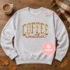 Light sweatshirt displayed flat with the Coffee Weather applique embroidery design