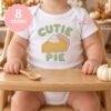 Cutie Pie pumpkin pie embroidery design displayed in a Thanksgiving setting