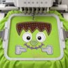Monster Face Applique Design centered inside a rectangular plastic machine-embroidery hoop.
