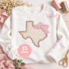 Texas with bow applique embroidery design on white sweatshirt